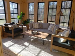 Beautiful Muskoka room with plenty of comfortable seating